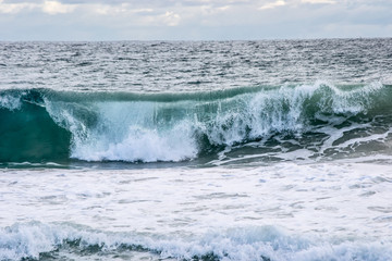 Fototapeta premium Landscape of a beach in north perth in a windy day full of waves water