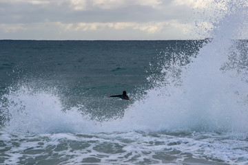 Landscape of a beach in north perth in a windy day full of waves water