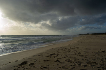 Landscape of a beach in north perth in a windy day full of waves water