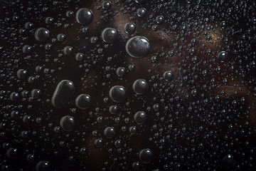 Water droplets on black background rain macro