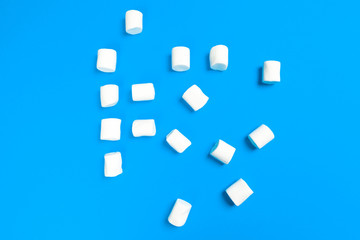 Fototapeta na wymiar Marshmallows on blue background