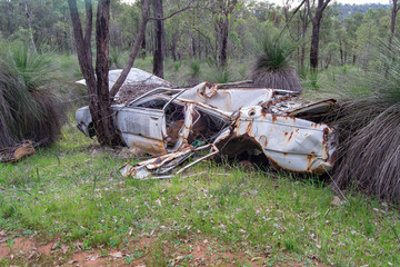 Abandoned and old car in the middle of the nature on Perth surroundings