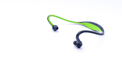 Wireless headphones closeup on white background with selective focus and crop fragme