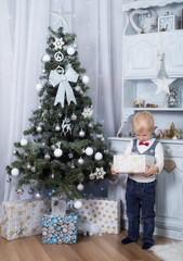 Adorable child holding a gift box