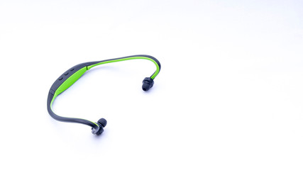 Wireless headphones closeup on white background with selective focus and crop fragme