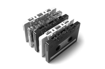 closeup of black and white vintage audio cassettes on white background