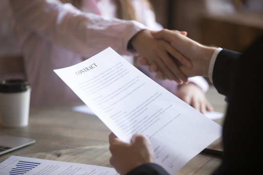 Business partners handshaking signing contract. Deal with good result, start of work with business partner or customer, agreement conclusion, client enters into a contract, human resource. Close up