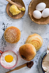 Traditional breads with ingredients on bright background
