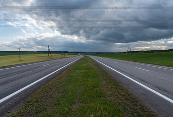 Highway before the storm. Dramatic clouds