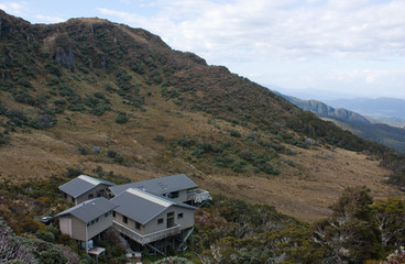 A landscape with the Okaka Lodge at the top of the Humpridge Walk in Fiordland / Southland in the South Island in New Zealand