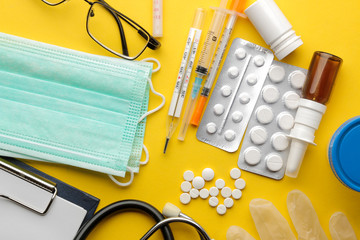 Table doctor. Medical supplies on a bright yellow background. view from above. Flat lay