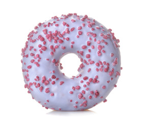 Sweet donut with a lilac-colored icing and sprinkle close up on a white isolated background