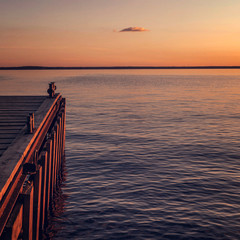 the smooth plain of the sea in the twilight of day leaving for the horizon