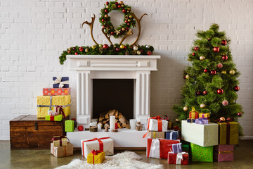 festive living room with cozy fireplace, christmas tree and presents