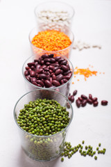 Lentils in glasses on the table. This legume contains a lot of vegetable protein