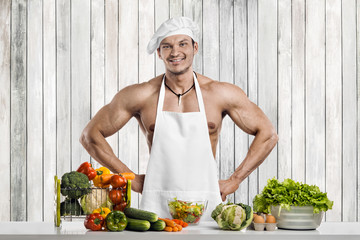 Man bodybuilder on kitchen