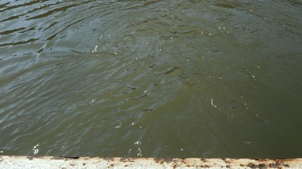 medium shot of water flow at canal river in stoke bruerne northamptonshire uk