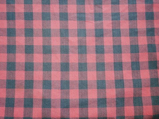 Red Square pattern fabric background. Scott chintz fabric for design.Plaid cotton texture.