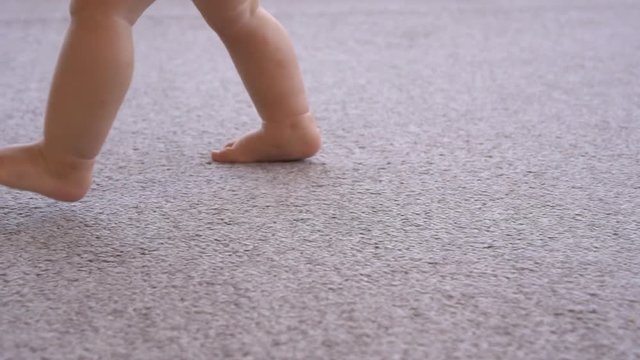 Baby girl learning to walk