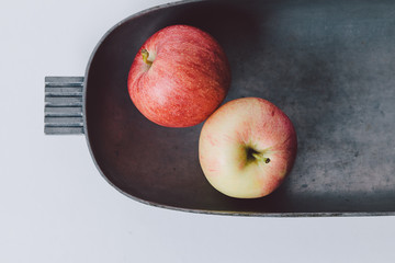Apples in a tin bowl
