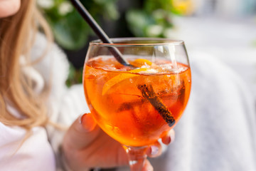 Aperol Spritz Cocktail. Alcoholic beverage with ice cubes and oranges