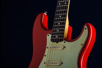 Detail of a red electric guitar