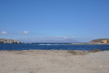 beach and sea with Mykonos in background 