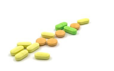 Obraz na płótnie Canvas Multicolored tablets and pills on a white background