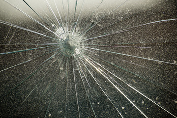 Glass with cracks from point impact