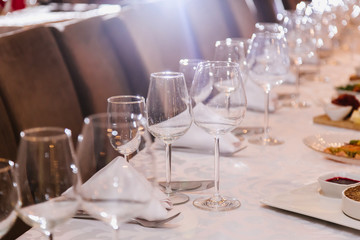 Table setting for many people, wine glasses