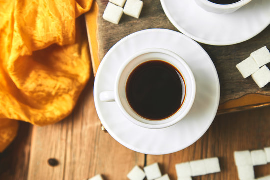 Two cups of coffee espresso near sugar cube