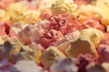 Fresh delicious colorful meringues background texture