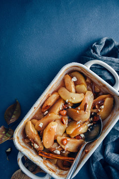 Overhead view of cinnamon baked apple slices in casserole