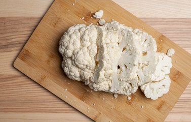 Cauliflower on wooden cutting board 