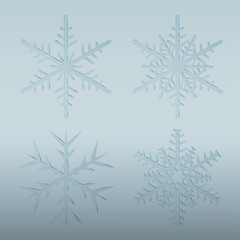 Glass snowflake set on blue winter holiday background. Vector Christmas and New Year design elements.