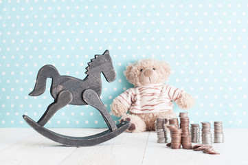 toy horse, teddy bear and change