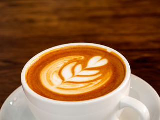 White coffee cup on wood table, coffee time