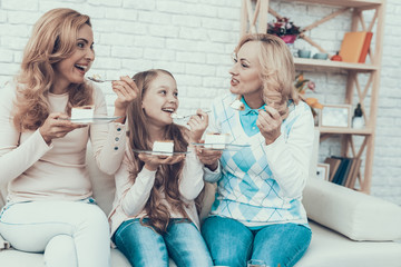 Happy Family Celebrating Birthday and Eating Cake.