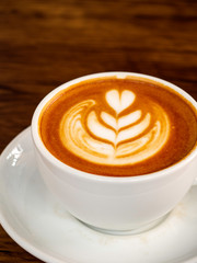 White coffee cup on wood table, coffee time