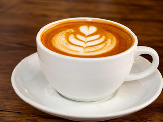 White coffee cup on wood table, coffee time