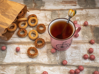Light lunch of bagels scattered on the table, tea