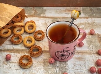 Light lunch of bagels scattered on the table, tea