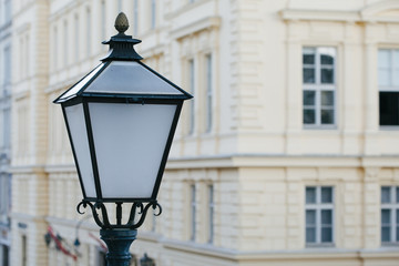 Fototapeta na wymiar Beautiful street lamp on the background of an old house