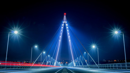 Illuminated cable suspension bridge perspective