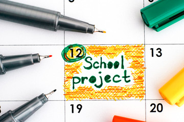 Reminder School Project in calendar with colour pens.