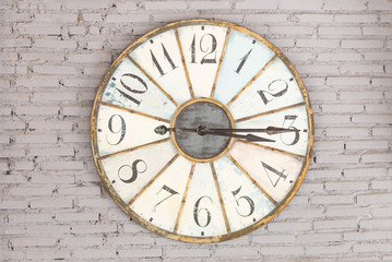 Retro clock showing three fifteen on the wall