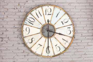 Retro clock showing three thirty on the wall