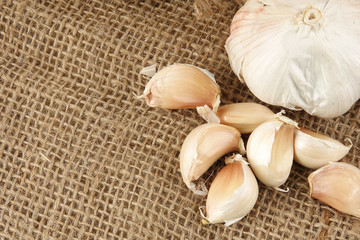 Onions on a brown rug background.