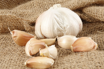 Onions on a brown rug background.