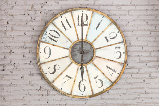 Retro clock showing six oclock on the wall